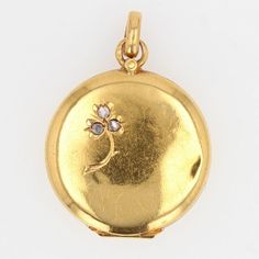 This is part of Chairish’s Fine Jewelry assortment.  Medallion in 18 karat yellow gold, eagle head hallmark.  On the obverse of this antique medallion is chiseled a clover, whose three leaves are rose- cut diamonds.  This antique pendant is opening.  Height : 2,8 cm, width : 2,1 cm, thickness : 4,5 mm.  Total weight of the jewel : 3,3 g approximately.  Authentic antique jewelry - French work circa 1900.  Small marks of time on both sides, very little visible.  Our opinion : An antique diamond medallion full of charm, from the last century.  This item has been used and may have some minor flaws. Before purchasing, please refer to the images for the exact condition of the item.  A return request must be submitted within 48 hours after delivery. Customer is responsible for return shipping cos Antique Medallion, Gold Eagle, Gold Medallion, Antique Pendant, The Jewel, Eagle Head, Antique Diamond, Dior Ring, Rose Cut Diamond