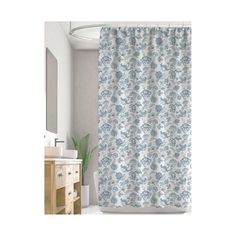 a shower curtain with blue and white flowers on it in a bathroom next to a sink