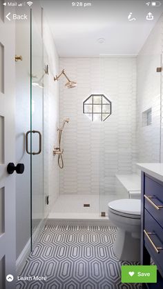 a white and blue bathroom with an open shower