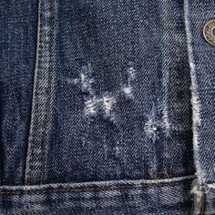 the back pocket of a pair of jeans with holes in it's side pockets