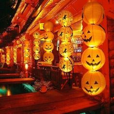 many lanterns are lit up in the shape of jack - o'- lanternes