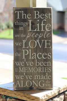 a wooden sign that says the best things in life are the people we love and the places we've been