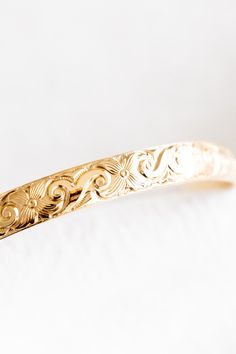 14k gold filled floral patterned bangle If you would like a different length that is not listed, please contact us for a custom order! Please note that there may be slight color variations or a seam where the joints of the bangle has been soldered. Since this piece is handmade, keep in mind that solder marks are visible and is totally normal. Finding Your Size We recommend using a flexible measuring tape to wrap around your hand/knuckles to find the length of your preferred fit. An alternative t Adjustable 14k Gold Jewelry With Intricate Design, Dainty Adjustable 14k Gold Bangle, Adjustable Dainty 14k Gold Bangle, 14k Gold Etched Bangle Bracelet, Adjustable Etched 14k Gold Jewelry, Adjustable 14k Gold Etched Jewelry, Dainty Engraved Bangle Jewelry, Adjustable Etched Gold Bangle, Adjustable Gold Etched Bangle