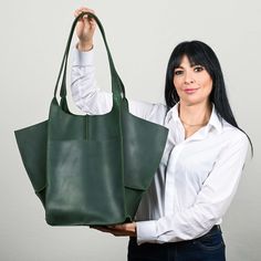 ● This bag model is simply the best solution for the modern woman. Its shape is perfect, the size is very roomy and you can get both comfort and a beautiful minimalist design in one bag. The quality of genuine leather for bags is very high, the bag keeps its shape perfectly. This bag will fit the most necessary daily items: phone, gadgets, cosmetic bags, wallet, notebook, water bottle. It is with such a bag that it is convenient to do shopping ● Inside there are two pockets for the phone and oth Modern Hobo Shoulder Bag With Pockets, Modern Shoulder Bag Tote With Pockets, Modern Tote Shoulder Bag With Pockets, Modern Shoulder Bag With Pockets For Shopping, Modern Shoulder Bag With Pockets, Modern Large Capacity Tote Weekender Bag, Modern Large Capacity Weekender Tote Bag, Modern Large Capacity Hobo Bag For Shopping, Modern Large Capacity Hobo Bag