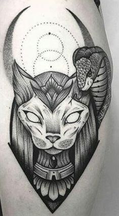 an egyptian cat tattoo on the thigh