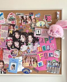 a bulletin board covered in stickers and magnets with a pink bunny stuffed animal