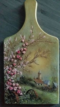 a decorative cutting board with flowers painted on it