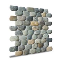 a stone wall sculpture made out of rocks