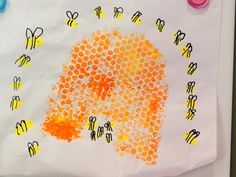 a child's handprint art project with bees on it and the words bubble print bee hive