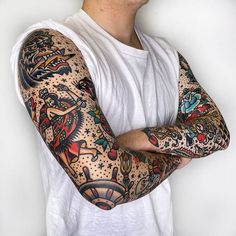 a man with tattoos on his arm and arms