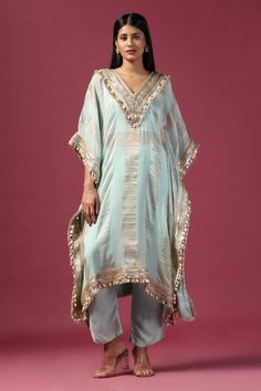 Aqua kaftan with stripe woven motifs and thread, shell, coin, sequin embroidered neckline. Paired with bustier and pant. - Aza Fashions Silk Kaftan With Gota Work In Traditional Drape, Festive Silk Kaftan With Gota Work, Designer Silk Kaftan With Gota Work, Festive Silk Kaftan With Sequins, Traditional Summer Kurta With Sequins, Traditional Sequined Summer Kurta, Bohemian Kaftan With Gota Work For Festivals, Bollywood Style Festive Kaftan With Tassels, Designer Sequined Kaftan For Festivals