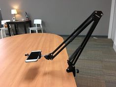 a cell phone on a tripod in an office