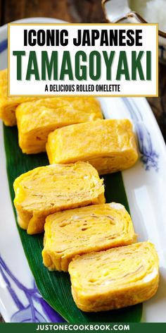 some food that is on a plate with the title text below it reads, iconic japanese tamagoyaki delicious rolled omelette