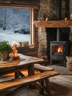 a wood burning stove sitting inside of a living room next to a table and chairs