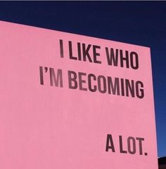 a pink sign that says i like who i'm becoming a lot