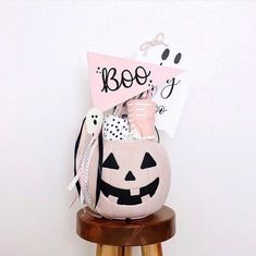 a pumpkin shaped bag sitting on top of a stool