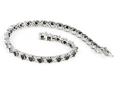 0.90ctw round black diamond, rhodium over sterling silver tennis bracelet. Measures approximately 7"L x 1/8"W and has a hidden box clasp. Black rhodium enhanced settings. Black Diamond Round Tennis Bracelet, Black Diamond Round Bracelet, Classic Silver Tennis Bracelet With Black Diamonds, Black Diamond Bracelet With Diamond Accents, Black Diamond Bracelet With Accents, Silver Tennis Bracelet With Black Diamonds For Formal Occasions, Silver Tennis Bracelet With Black Diamonds, Black Diamond Tennis Bracelet As Gift, Black Diamond Tennis Bracelet Gift