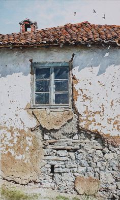 an old building with a broken down window and birds flying around the window sill