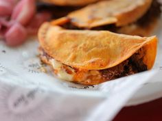 a close up of a sandwich on a paper plate