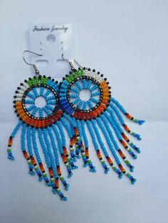 This African beaded Masai earring are made of beads which comes in different colours of ones choice. They can be warn at any given time, whether in weddings, parties, or any occasion. Note:This listing is for one pair,  but I do both wholesale and retail Traditional Blue Beaded Earrings, Adjustable Colorful Beaded Round Earrings, Beaded Round Earrings For Festival, Traditional Round Beaded Earrings With Large Beads, Party Earrings With Colorful Beads In Round Shape, Blue Round Beaded Earrings With Colorful Beads, Adjustable Round Beaded Earrings With Tiny Beads, Traditional Beaded Earrings With Colorful Beads For Party, Traditional Colorful Beaded Earrings For Party