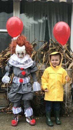 two children dressed up as clowns with red balloons