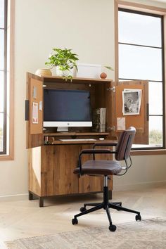 an office chair sitting in front of a desk with a computer on top of it