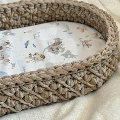 a close up of a basket on a bed