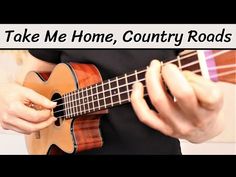 a person playing an ukulele with the words take me home, country roads