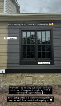 a house with two windows and some stickers on the window sill that says, june is looking glidd / backed project wise