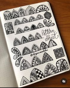 an open notebook with lots of doodles on it