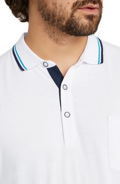 Slim tipping stripes ring the collar and sleeves of a polo made of breathable cotton piqué in a fit that's perfect for relaxing on warm, sunny days. Rib collar   Short sleeves   100% cotton   Machine wash, line dry   Imported Collared Polo Shirt With Contrast Stripes For Golf, Cotton Golf Tops With Contrast Stripes, White Polo Shirt With Striped Cuffs, White Casual Polo Shirt With Contrast Trim, Casual White Polo Shirt With Contrast Trim, White Polo Collar Top With Striped Cuffs, Cotton Polo Shirt With Striped Cuffs, White Cotton Polo Shirt With Contrast Trim, White Cotton Polo Shirt With Striped Collar