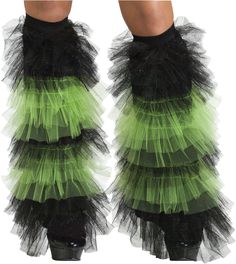 a pair of legs wearing green and black ruffled socks with high heeled boots