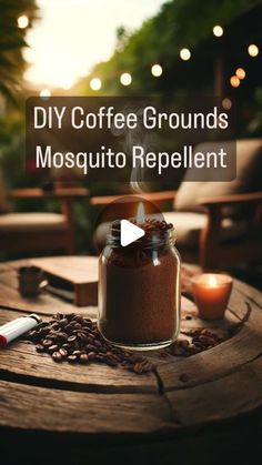 coffee grounds mosquito repellent in a jar on top of a wooden table with candles