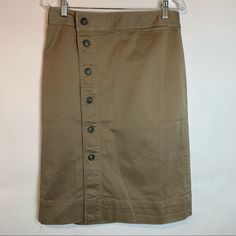 Brand: J.Crew Size: 8 Tall Color: Dusty Khaki Condition: New With Tags Style Type: Pencil Sits At Waist. Length: 25” Falls Below Knee. A Lipstick Pocket And Cute Tortoise Buttons Make This Pencil Skirt On Pointand Our Classic Stretch Chino Means You Can Wear It All Day. Cotton/Elastane. Button Closure. Machine Wash. Cotton Workwear Skirt With Button Zip Fly, Khaki Bottoms With Buttons, Seersucker Skirt, Dark Denim Skirt, Striped Skirt Pencil, Navy Skirt, Flounce Skirt, Tweed Mini Skirt, Denim Pencil Skirt