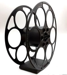 a black spool with holes on it