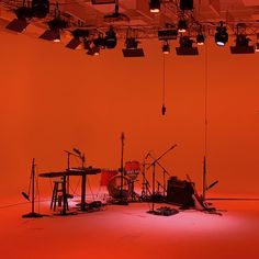 an orange room with musical instruments and lights