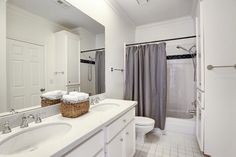 a bathroom with a sink, toilet and shower in it's own home area