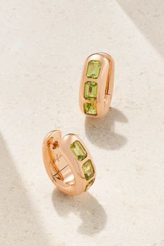 Pomellato's hoop earrings are modeled after pieces from its early 'Bisanzio' collection, which combines the opulence of the Byzantine empire with a modern Milano-inspired design. Handcrafted in Italy from pale 18-karat rose gold, they have a classic hoop shape that's set with a trio of vibrant green peridot. Pomellato Iconica Earrings, Luxury Gemstone Hoop Earrings, Elegant Green Hoop Earrings Pierced, Elegant Green Pierced Hoop Earrings, Elegant Green Huggie Jewelry, Luxury Single Huggie Earring, Luxury Gold Gemstone Hoop Earrings, Luxury Gold Hoop Earrings With Gemstone, Luxury Green Hoop Earrings