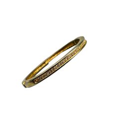 This vintage gold-tone hinged bangle features a row of sparkling rhinestones, offering a timeless and elegant accessory with a touch of antique charm. * Gold-tone finish * Rhinestone embellishments * Hinged closure  * Inner diameter approx. 2.25 inches Metal wear visible on close inspection. Features: * bracelet Size: Womens 2.25" x 2" Condition: Pre-Owned Good Please be aware that pictures are an important part of my description, please look at all photos and zoom in if needed.  All my items ar Bracelets Design, The Bangles, Vintage Bangles, Rhinestone Embellishments, Bangle Designs, Hinged Bangle, Elegant Accessories, Antique Items, Women Accessories Jewelry