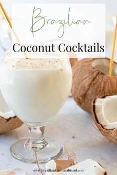 a glass filled with coconut cocktail next to some cut up coconuts