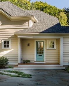 a house with a blue front door and white trim