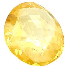 an oval shaped yellow diamond on a white background