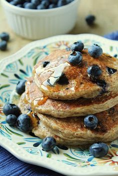 stack of pancakes with blueberries on a plate