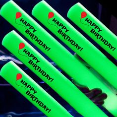 four green birthday candles with the words happy birthday written on them