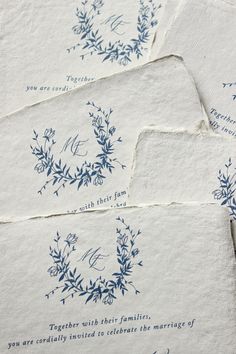 four napkins with blue ink on them and some type of handwritten wedding card