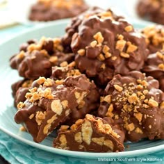 a plate full of chocolate covered cookies on a table