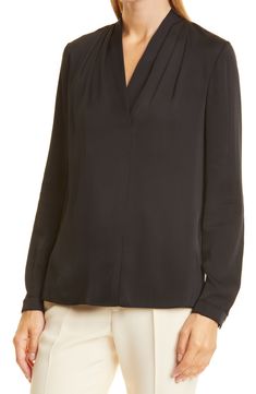 A stretch-kissed silk blouse adds a lustrous layer and an elegant drape to whatever your day (or night) has in store. Surplice V-neck Long sleeves with one-button cuffs 95% silk, 5% elastane Dry clean Imported Women's Clothing Elegant V-neck Blouse For Layering, Elegant Silk Crepe Blouse For Work, Elegant Black Silk Top, Elegant Viscose Blouse For Layering, Elegant Fitted Blouse For Layering, Elegant Silk Crepe Blouse For Evening, Fitted Silk Crepe Evening Tops, Versatile Viscose Blouse For Formal Occasions, Elegant Silk Blouse For Layering