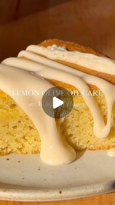 a piece of lemon cake on a plate with icing drizzled over it