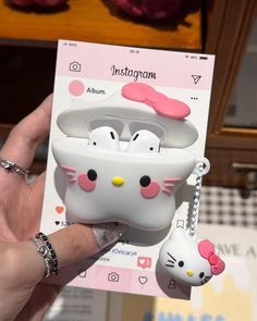 a hello kitty cell phone case is being held up