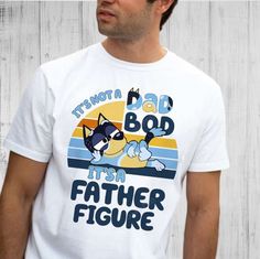 Introducing the ultimate collection of shirts dedicated to all the amazing fathers out there! Our “It’s Not A Dad Bod Blue Relaxed Fit T-shirt For Father's Day, Father's Day Blue Short Sleeve Tops, Blue Cotton T-shirt For Father's Day, Pre-shrunk Blue T-shirt For Father's Day, Father's Day Blue Pre-shrunk T-shirt, Blue Pre-shrunk T-shirt For Father's Day, Father's Day Cotton T-shirt With Character Print, Father's Day Blue Top With Custom Print, Blue Custom Print Top For Father's Day